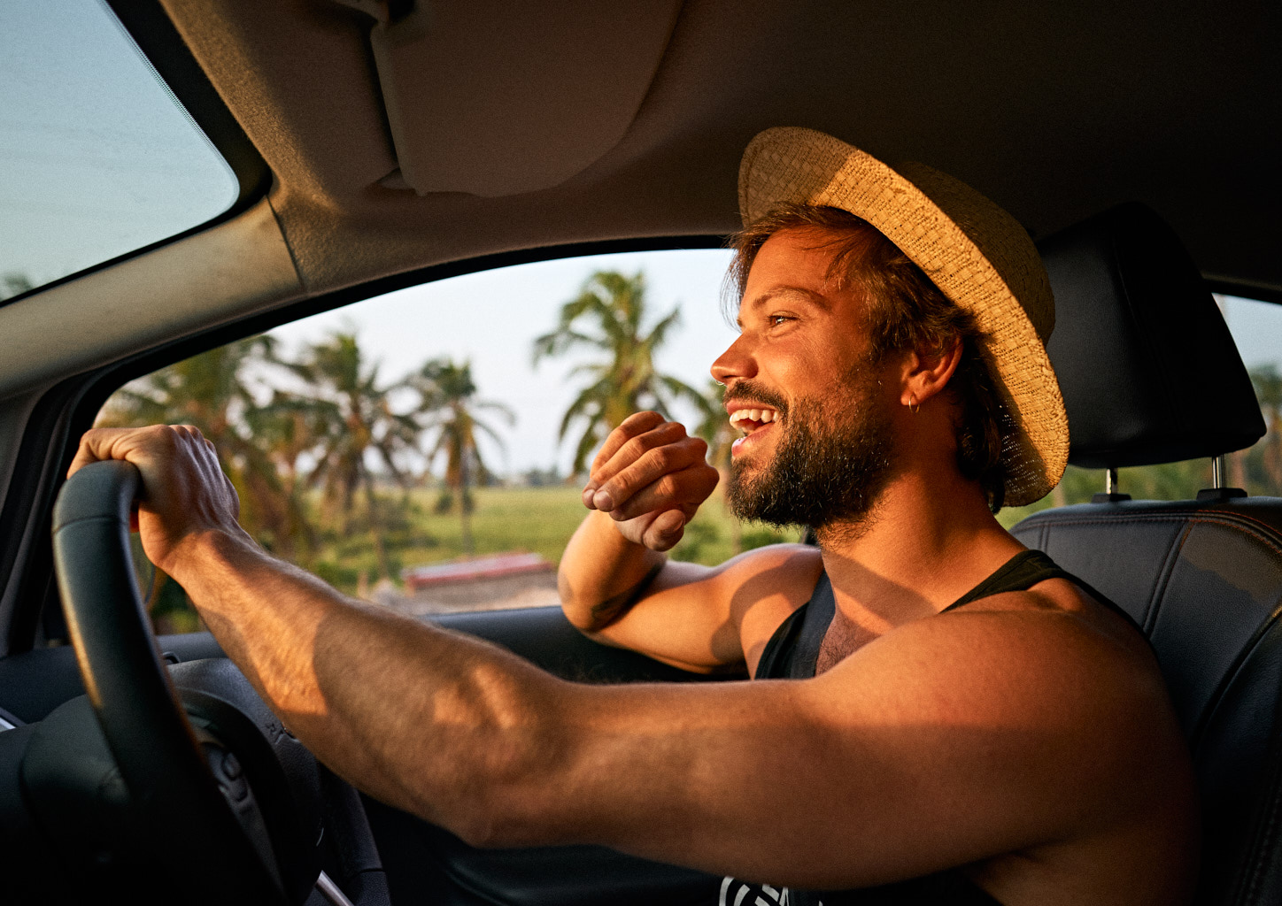Handomse man driving a Ford SUV